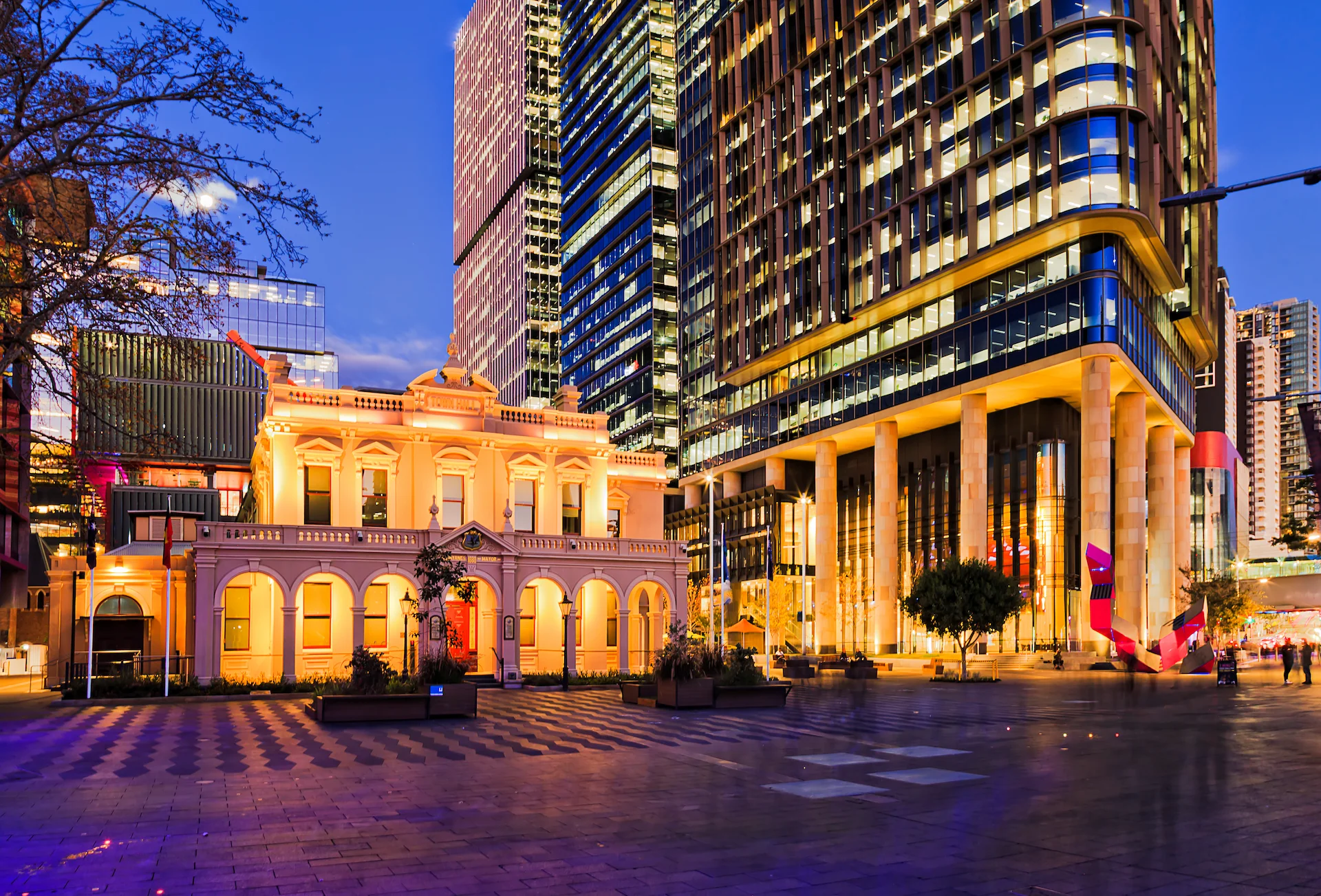Parramatta CBD townhall historic building and modern urban high-rise towers at sunrise.